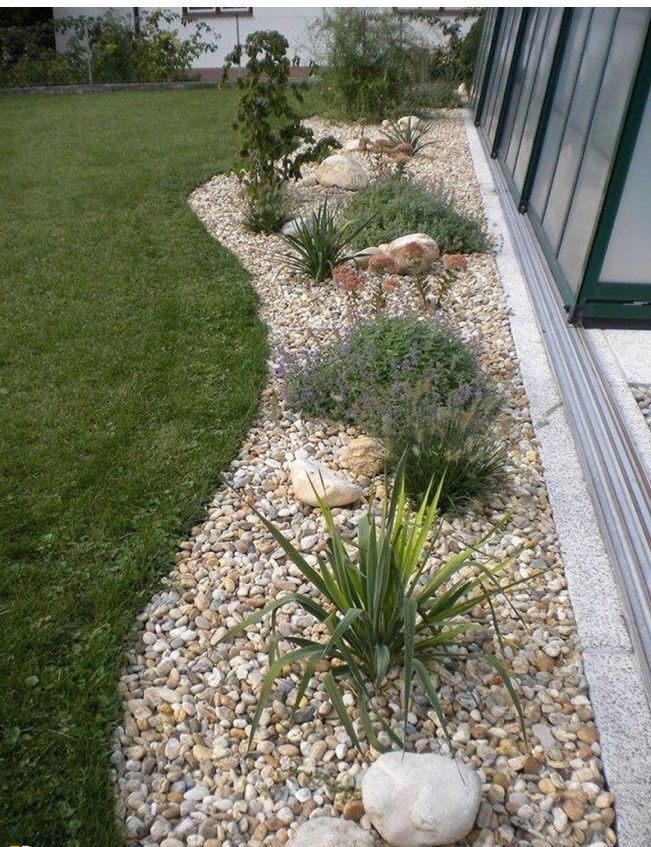 rock flower beds in front of house