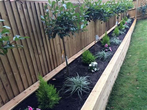 Optimal use of space: Utilizing raised garden beds along the fence for your garden