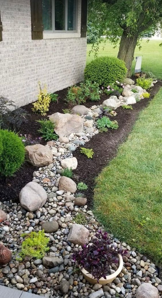 Rock flower beds: a beautiful addition to the front of your house