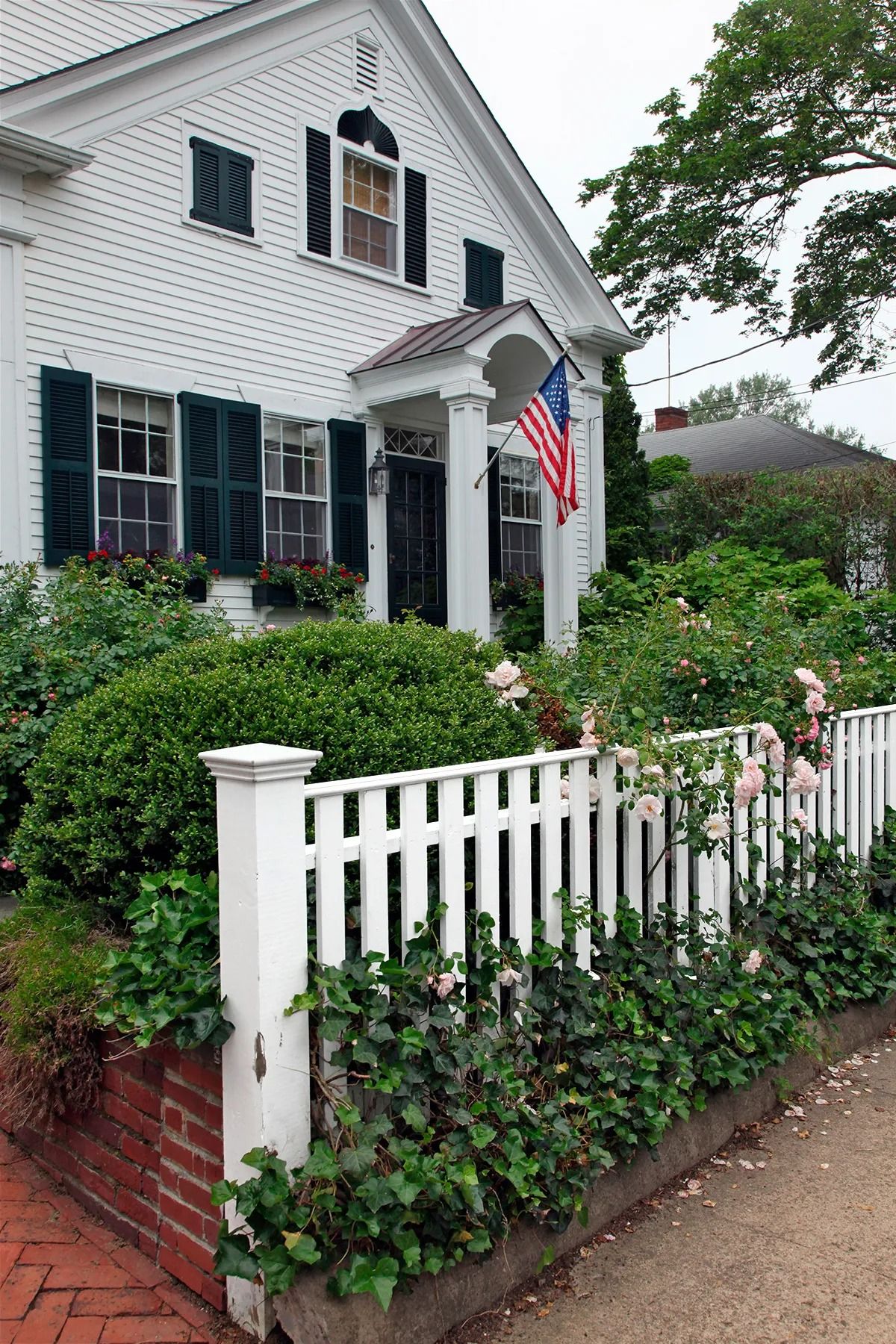 The Allure of a Classic White Picket Fence Front Yard