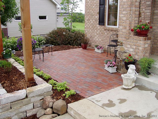 Charming Front Yard Patio with Boral Clay Pavers and Natural Stone .