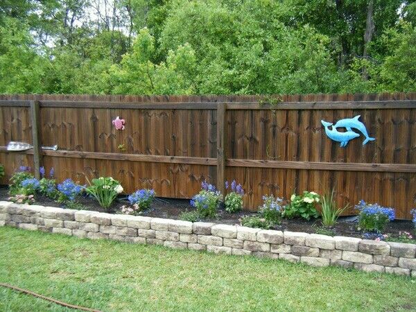 Flower bed along fence | Outdoor garden decor, Backyard garden .