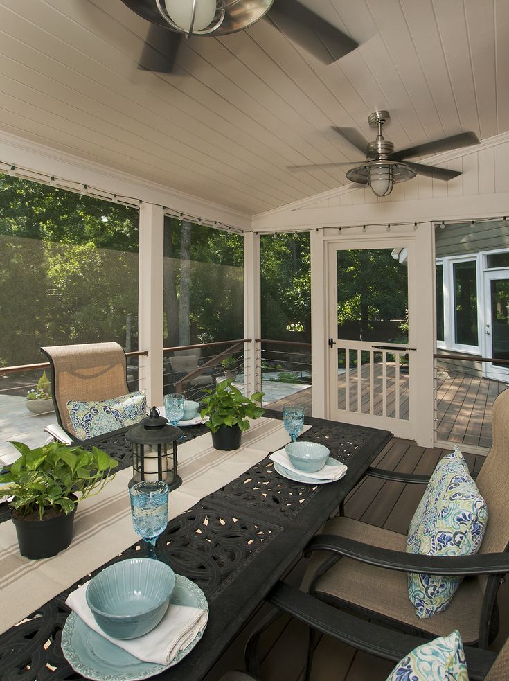 Screened back porch designed and built by Atlanta Decking & Fence .