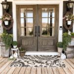Farmhouse Porch Ideas for Spring with faux flowers and greene