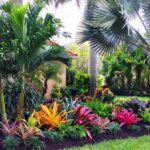 Tropical Garden Design with Palm Trees and Colorful Flowe